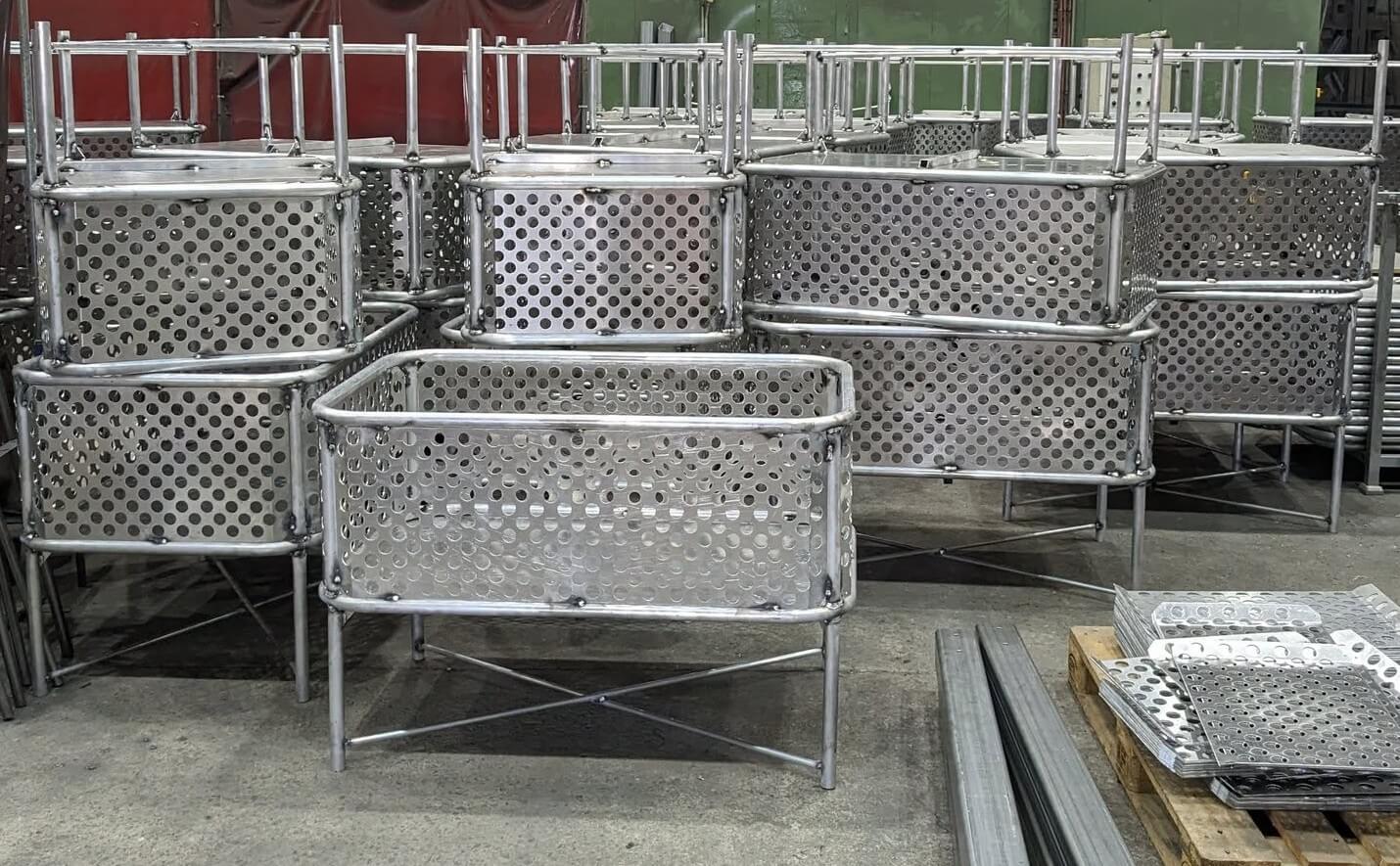 Production run of aluminium post office trolleys showing tube bending, CNC punched and formed sheet components, welding and assembly for repeat supply Sydney