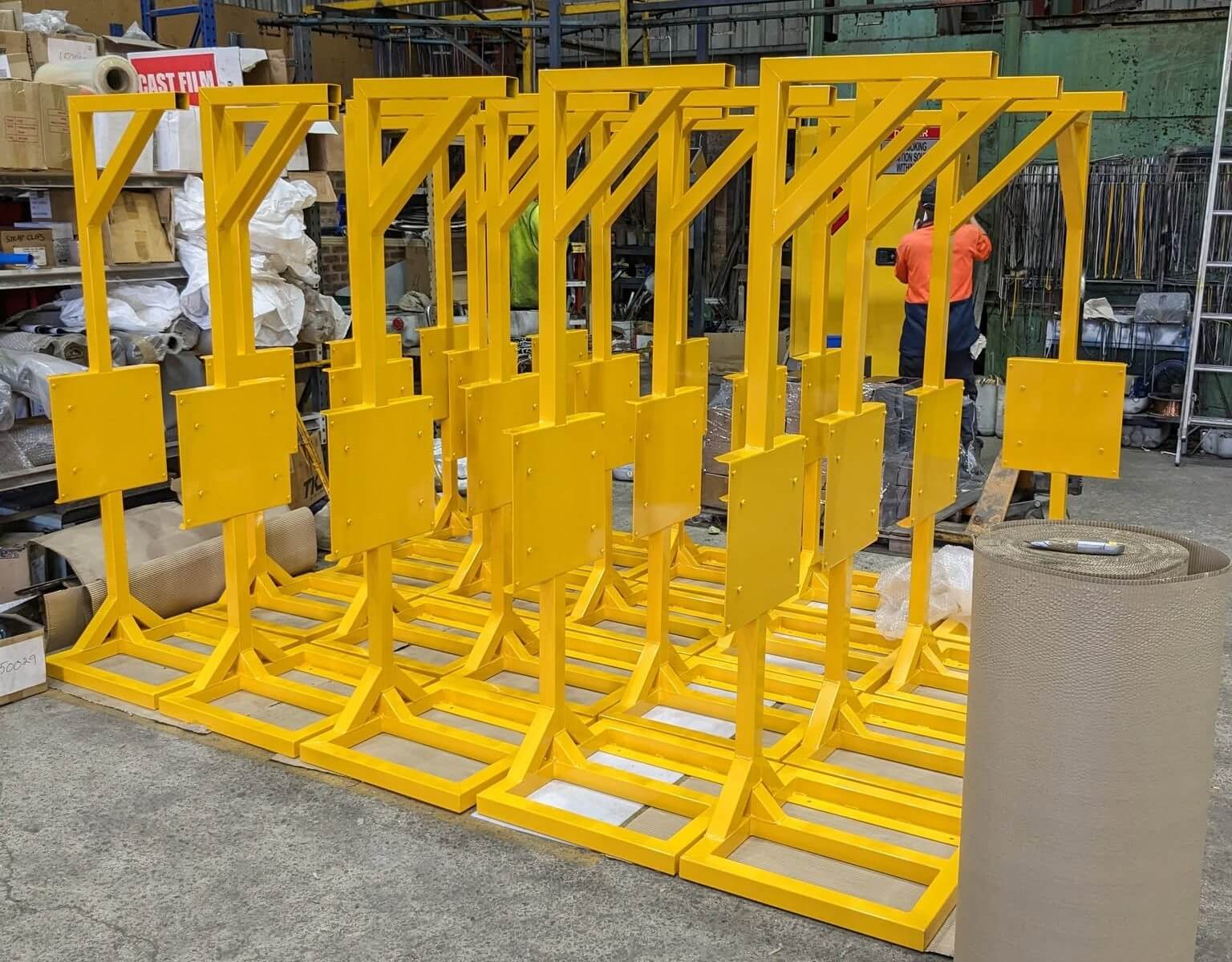 Yellow powder coated finished HelloFresh manufactured battery charging frames by EFC Industries Sydney